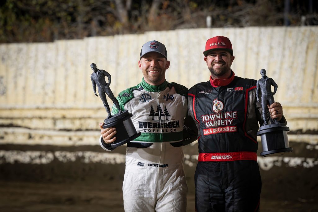 American Sprint Car Series drivers Seth Bergman and Sam Hafertepe Jr. posing for a photo with their championship trophies.