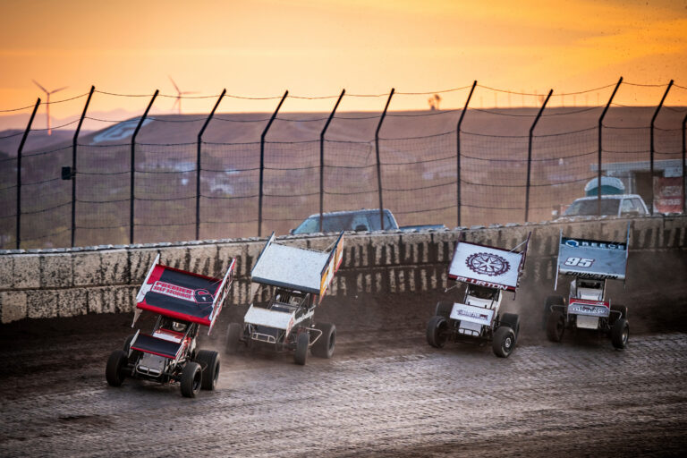 Sprint Cars. racing across mountains and sunset